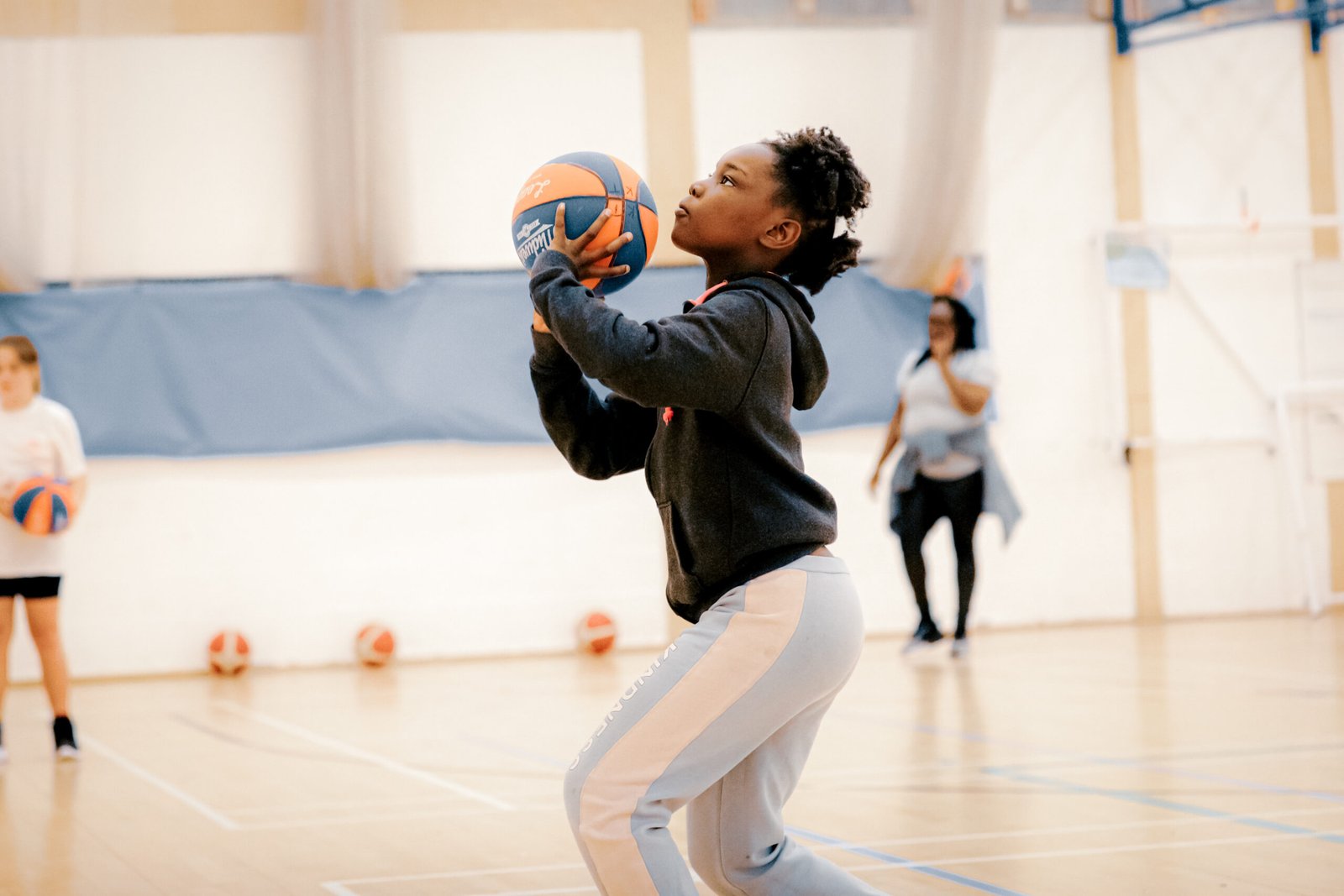 Girl shooting basketball