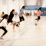 Girls dribbling the basketball