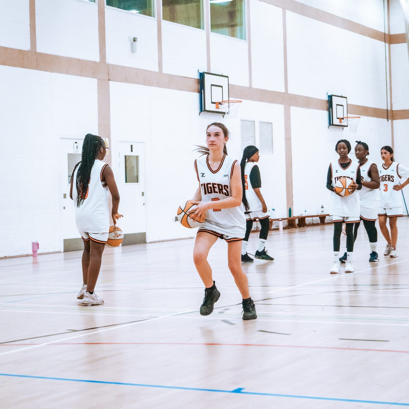 U14 Girls player performing a layup line